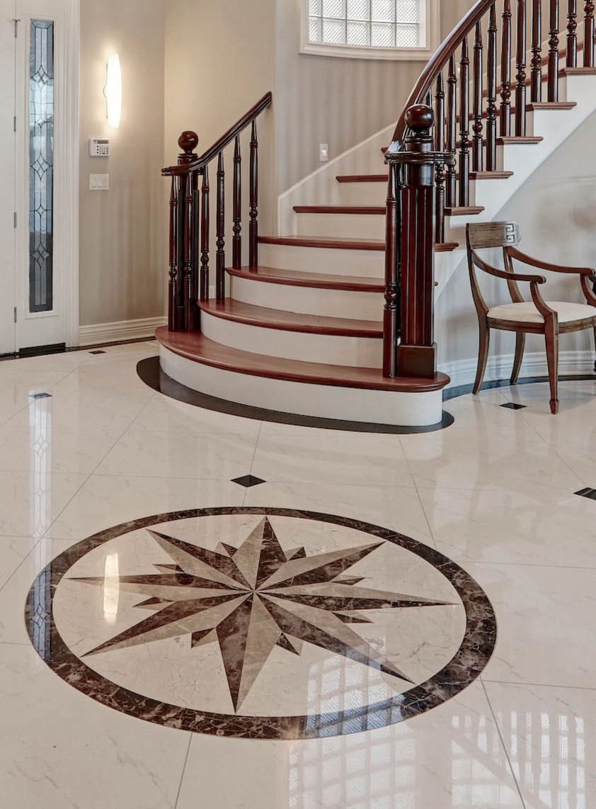 Stunning two story entry foyer with lots of space boasts marble mosaic tile floor, front door framed with arch window and sidelights, grand staircase with glossy wood curved banister. Northwest, USA